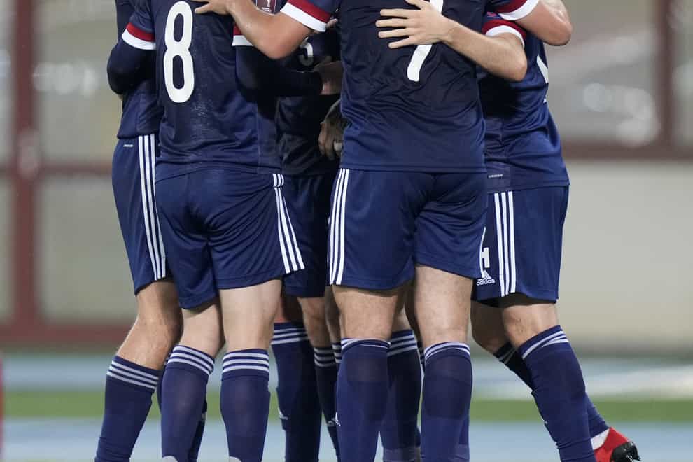 Scotland celebrate Lyndon Dykes’ goal (Florian Schrotter/PA)