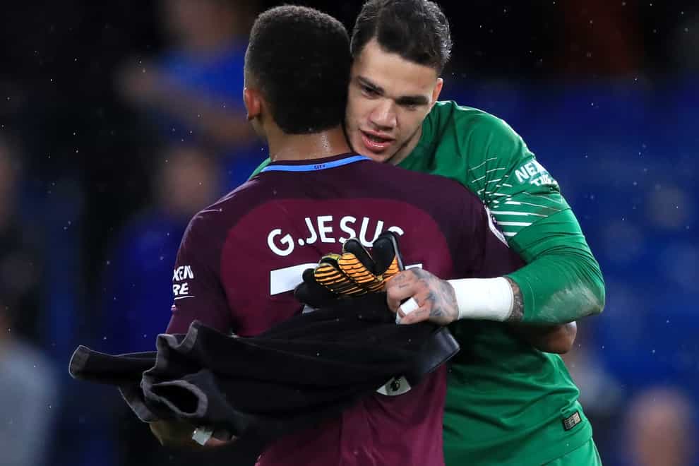 Manchester City duo Ederson, right, and Gabriel Jesus are among eight Brazilian players who have had club restrictions placed on them (John Walton/PA)
