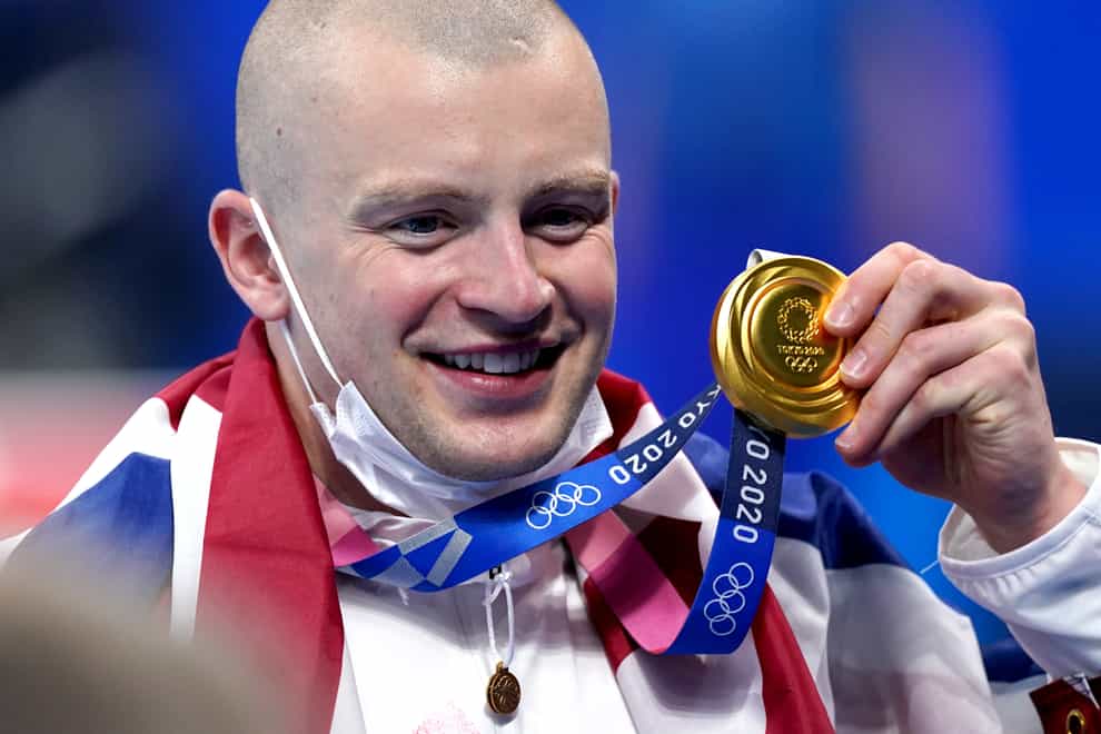 Adam Peaty with his 100m breastroke gold medal at the Tokyo Olympics (Adam Davy/PA).