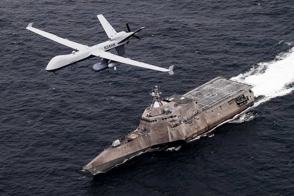 An MQ-9 Sea Guardian unmanned maritime surveillance drone flies over the USS Coronado (US Navy/Chief Mass Communication Specialist Shannon Renfroe, via AP)