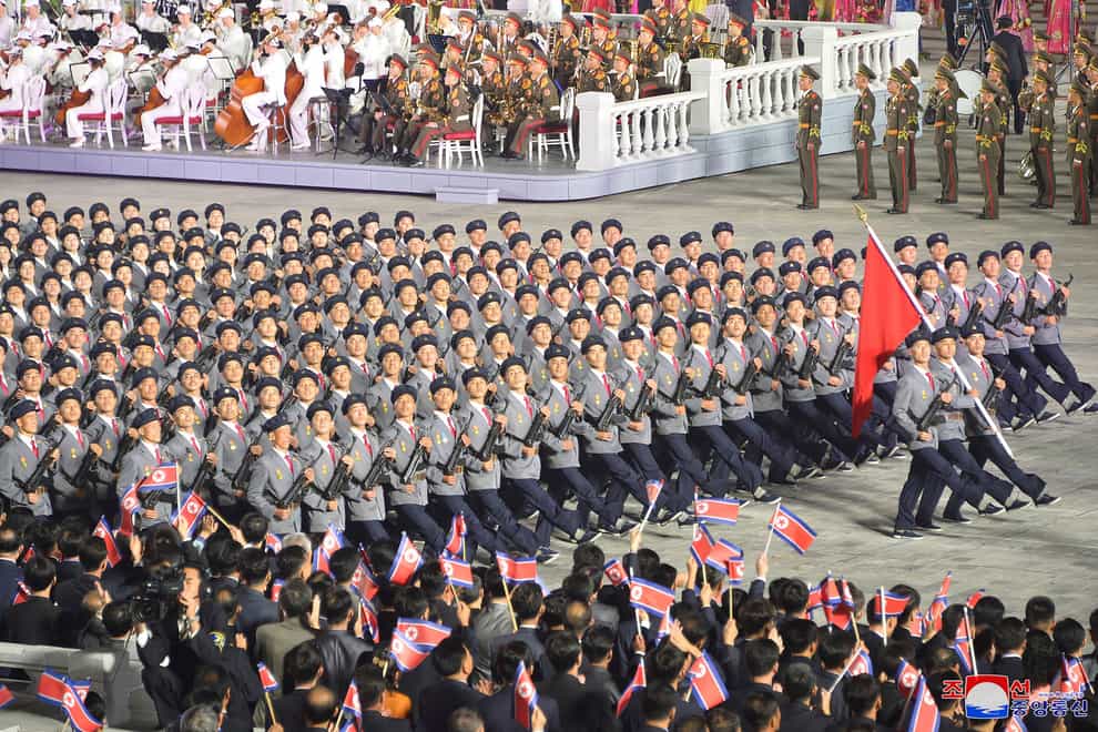 North Korean troops parade during a celebration of the nation’s 73rd anniversary that was overseen by leader Kim Jong Un (Korean Central News Agency/AP)