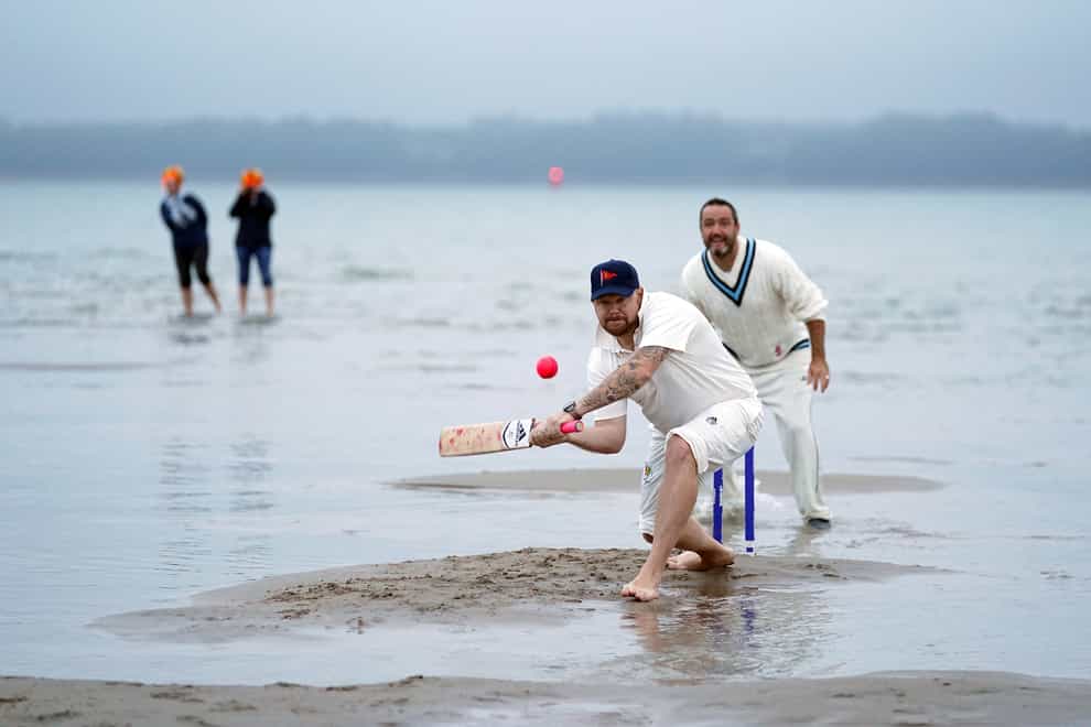 Members of the Royal Southern Yacht Club and the Island Sailing Club take part in the annual Brambles cricket match between the clubs (Andrew Matthews/PA)