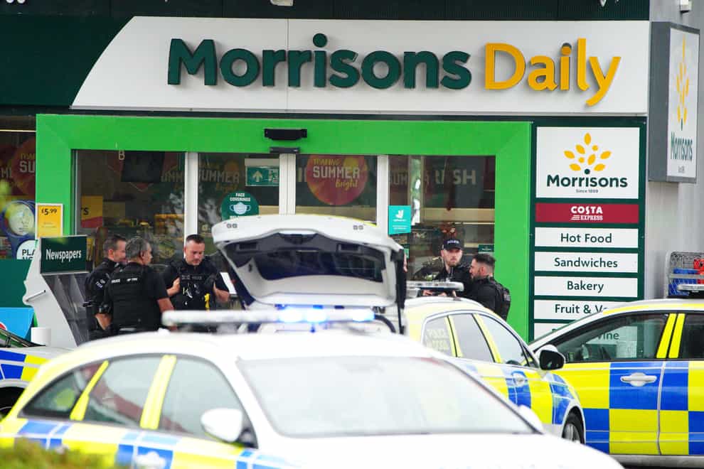 Armed police at the scene of an incident in Hengrove Way, Bristol, where a man armed with a knife is inside the shop of the petrol station. Staff members are uninjured within a safe room and in contact with officers. Picture date: Thursday September 9, 2021.