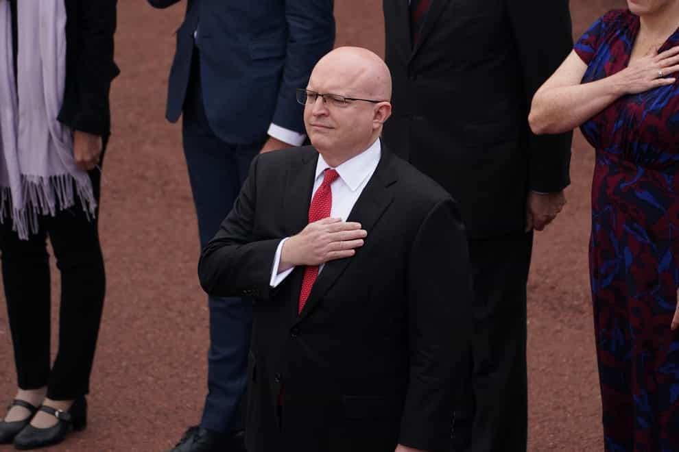 Acting ambassador Philip takes the salute as the US national anthem is played (Steve Parsons/PA)