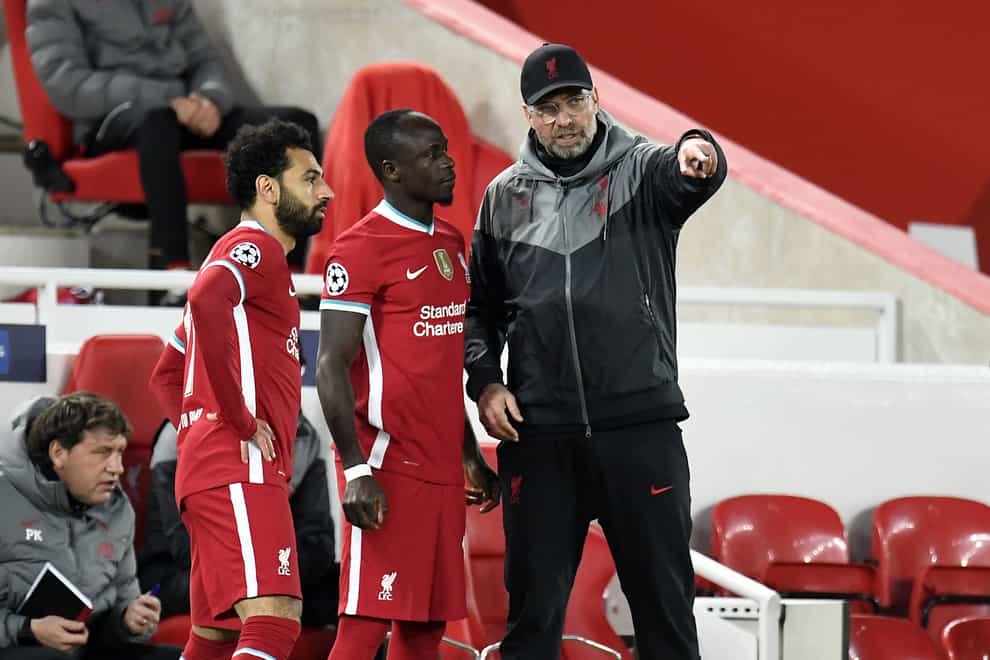 Liverpool manager Jurgen Klopp (right) will be without Sadio Mane and Mohamed Salah in January (Peter Powell/PA)