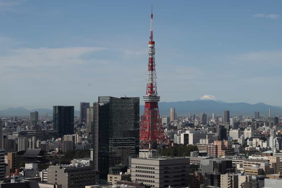 The Tokyo Tower with Mount Fuji in the distance (David Davies/AP)