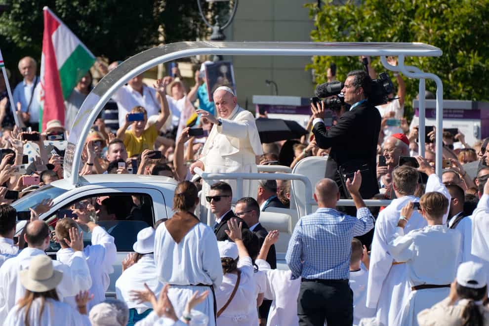 Pope Francis arrives on his popemobile to celebrate mass (Gregorio Borgia/AP)