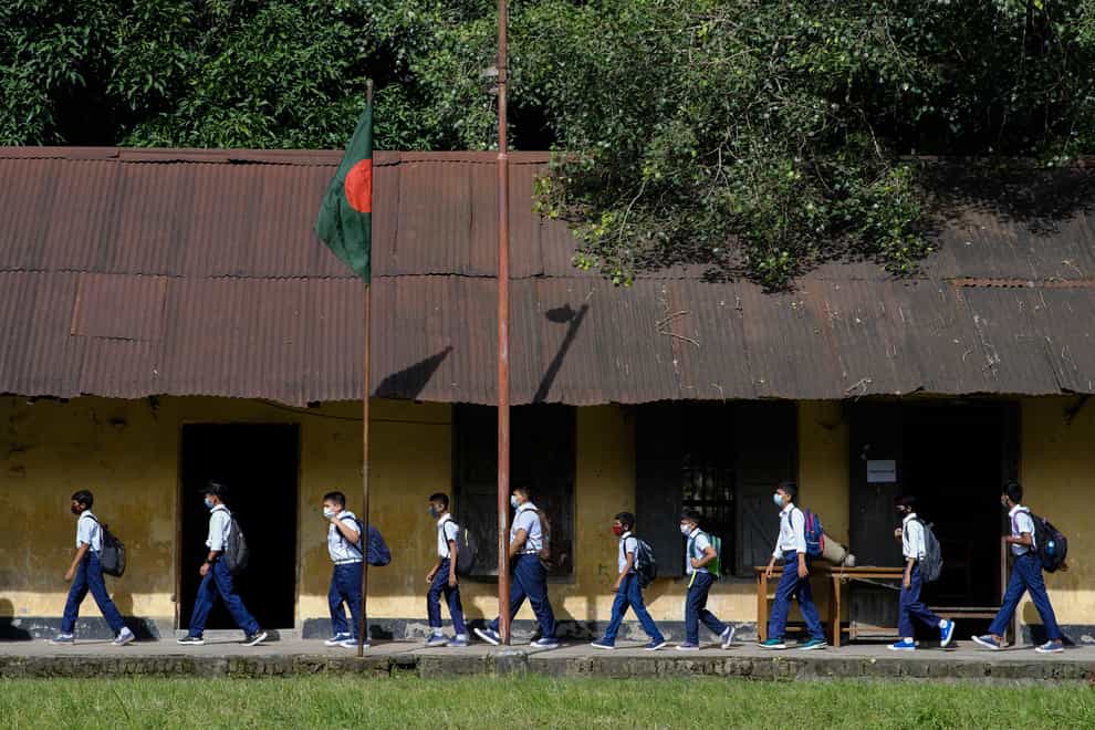 Students arrive at the Narinda Government High School (Mahmud Hossain Opu/AP)