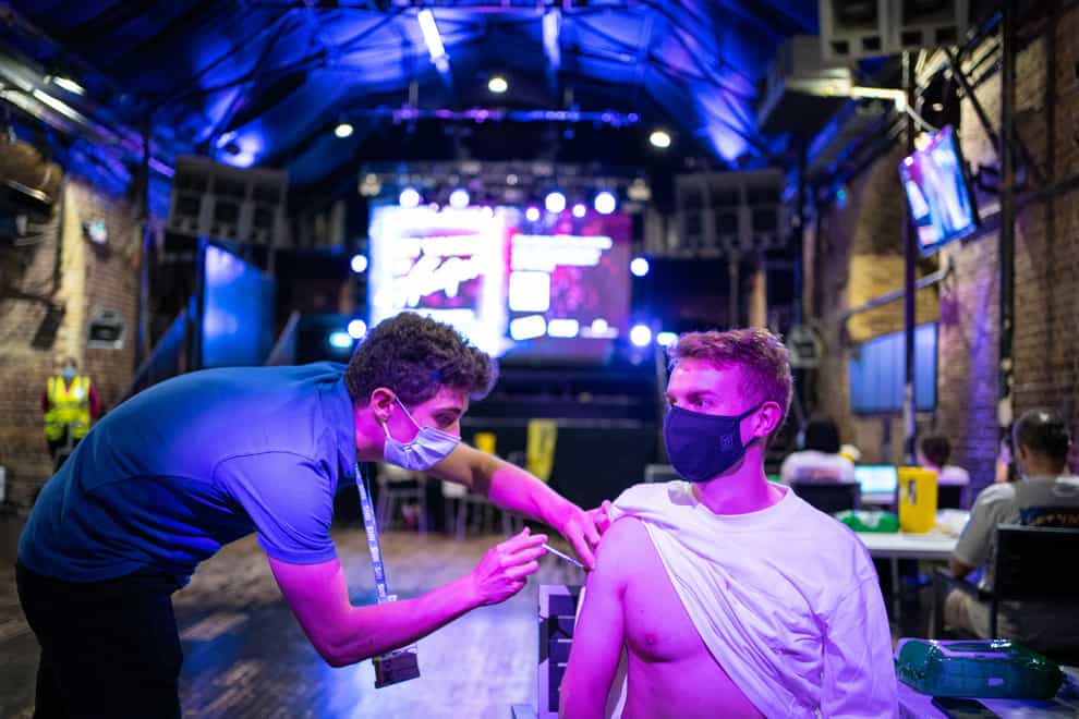 Chris Jordan receives a dose of coronavirus vaccine at a nightclub in central London (PA)