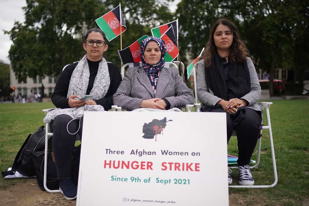 Three Afghan mothers (names withheld) who have been on hunger strike since Thursday September 9 – in protest against the Taliban takeover of Afghanistan – in Parliament Square (Yui Mok/PA)