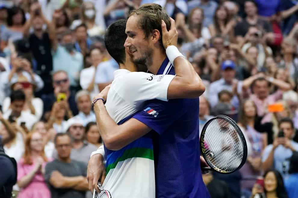 Daniil Medvedev, right, hugs Novak Djokovic at the end of the US Open final (Elise Amendola/AP)