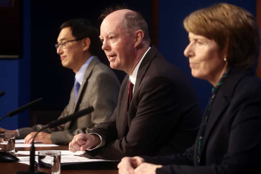Professor Wei Shen Lim, Chris Whitty, and Dr June Raine speak to the media (Hannah McKay/PA)