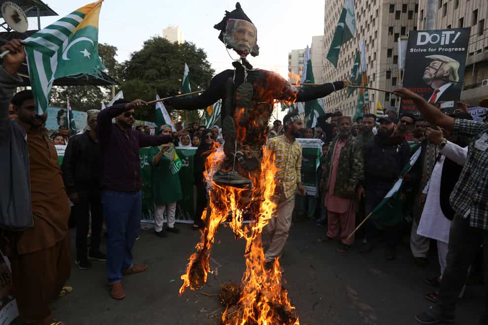 Protesters burn an effigy of the Indian prime minister during a Karachi rally to express solidarity with Indian Kashmiris (AP)