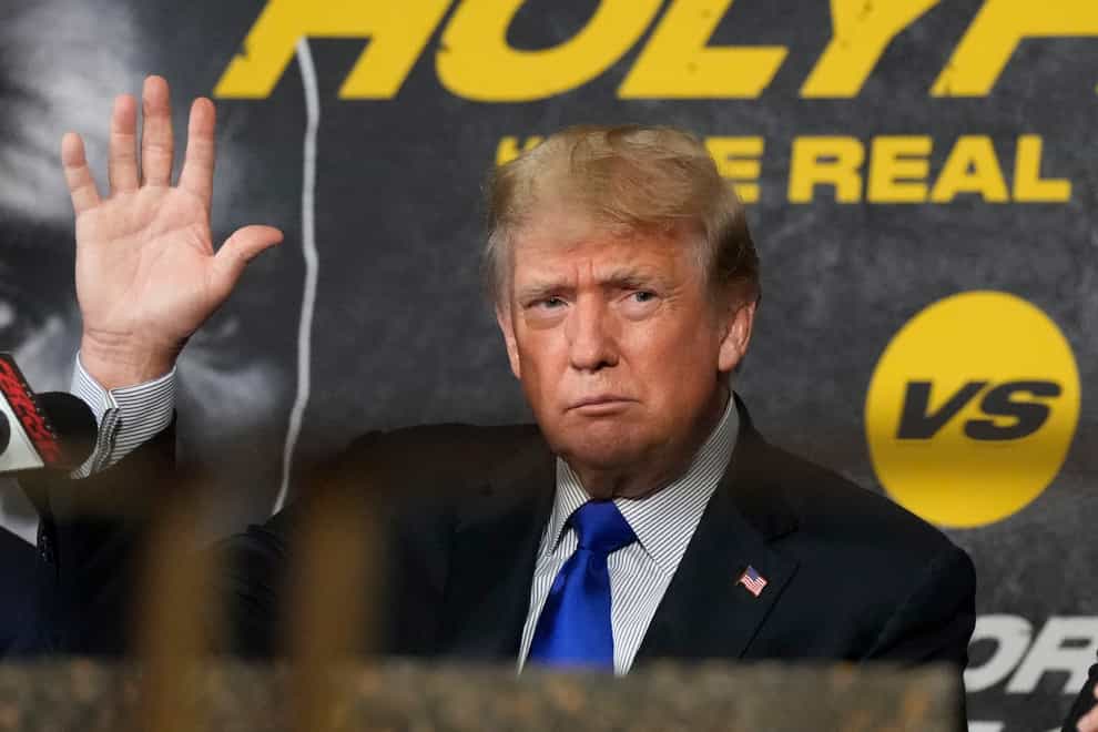 Former President Donald Trump at a boxing promotion in Florida on Saturday. A new book says the United States’ top military officer twice called his Chinese counterpart to assure him the two nations would not suddenly go to war during the final weeks of Mr Trump’s presidency (Rebecca Blackwell/AP)