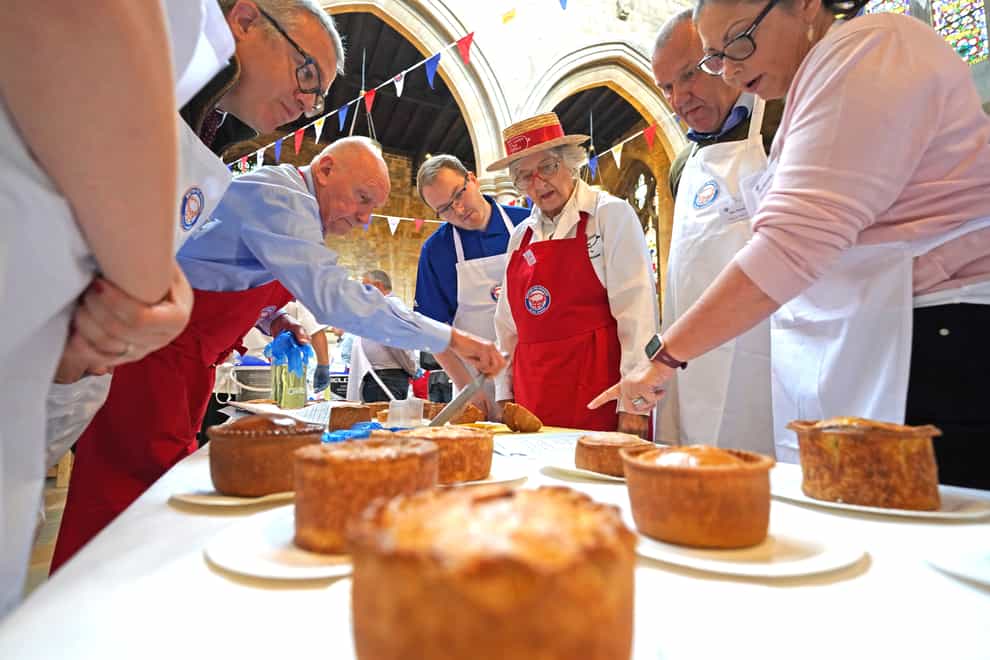 Judging is under way at the Annual British Pie Awards at St Mary’s Church in Melton Mowbray, Leicestershire (Jacob King/PA)