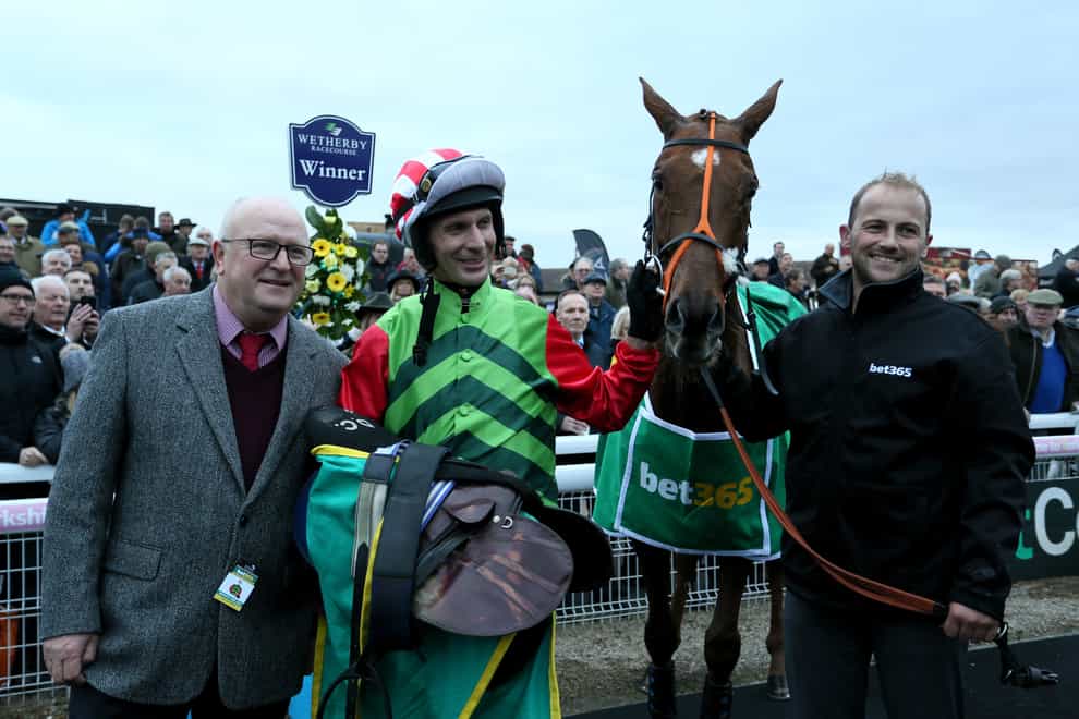 Danny Cook after winning the Charlie Hall on Definitly Red (Richard Sellers/PA)