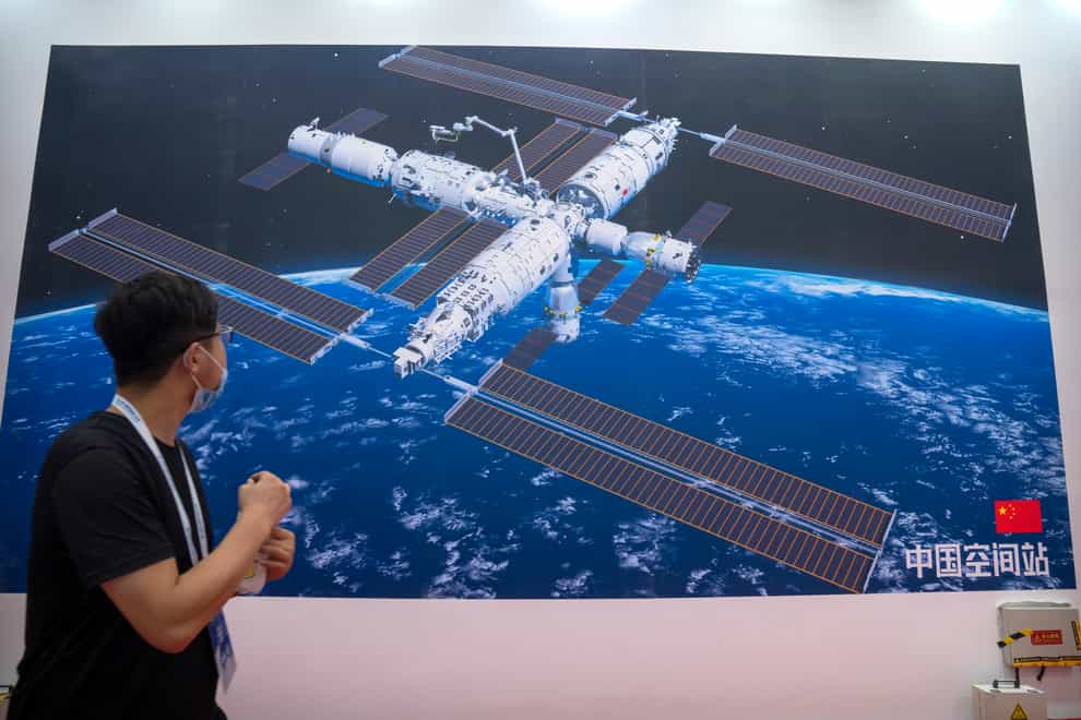 A mural showing an artist’s impression of China’s space station at the World Robot Conference in Beijing (Mark Schiefelbein/AP)