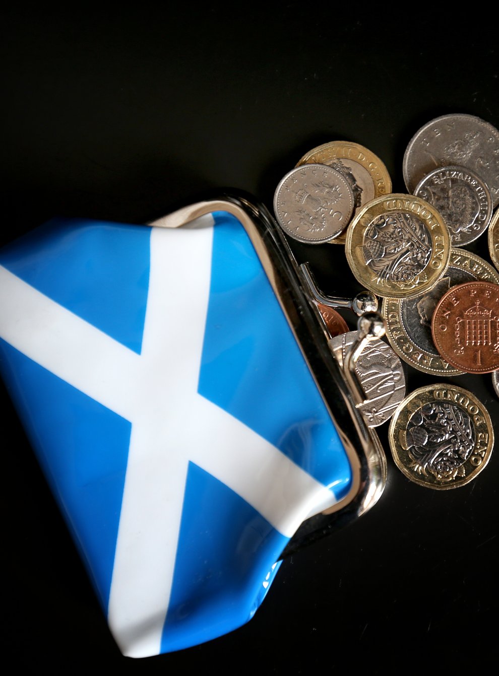 An independent Scotland could face spending cuts or tax rises ‘before too long’ – whichever currency position it adopts, a think tank claims (Jane Barlow/PA)