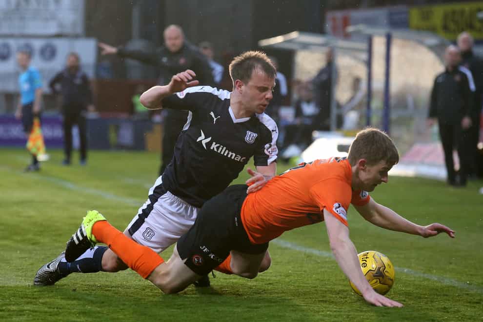 Paul McGowan, left, in action against Dundee United (Andrew Milligan/PA)