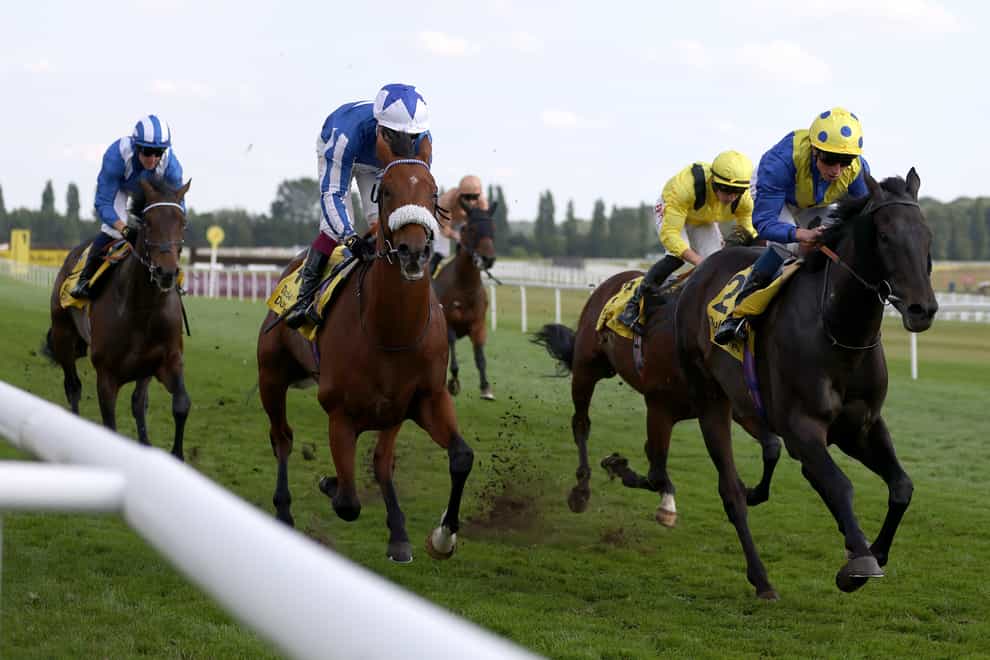 Solid Stone (yellow cap) battles back to win (Steve Paston/PA)