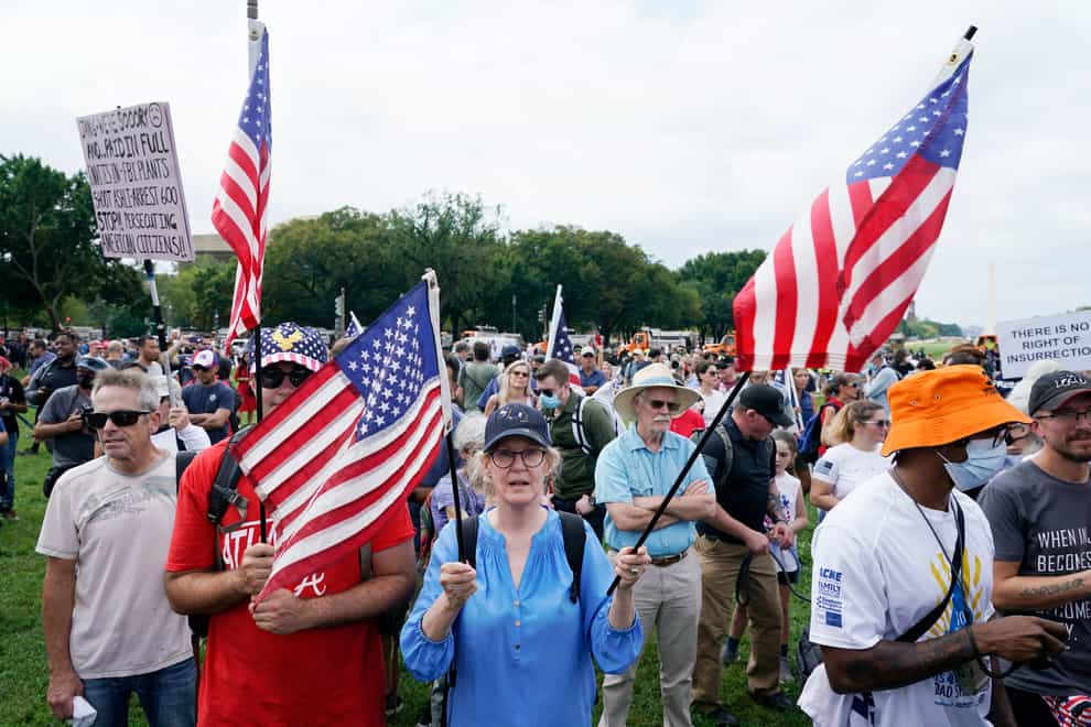 People attend a rally near the US Capitol in Washington (AP)