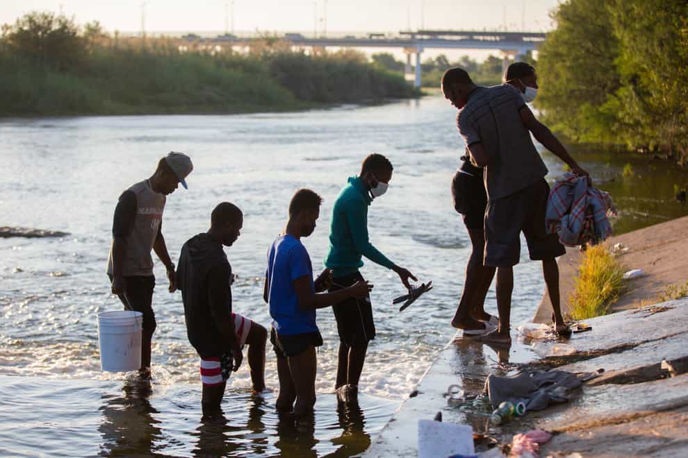 Haitian migrants part of the group of people from Haiti waiting in Del Rio and Ciudad Acuna to get access to the United States cross the Rio Grande (Marie D De Jesus/AP)