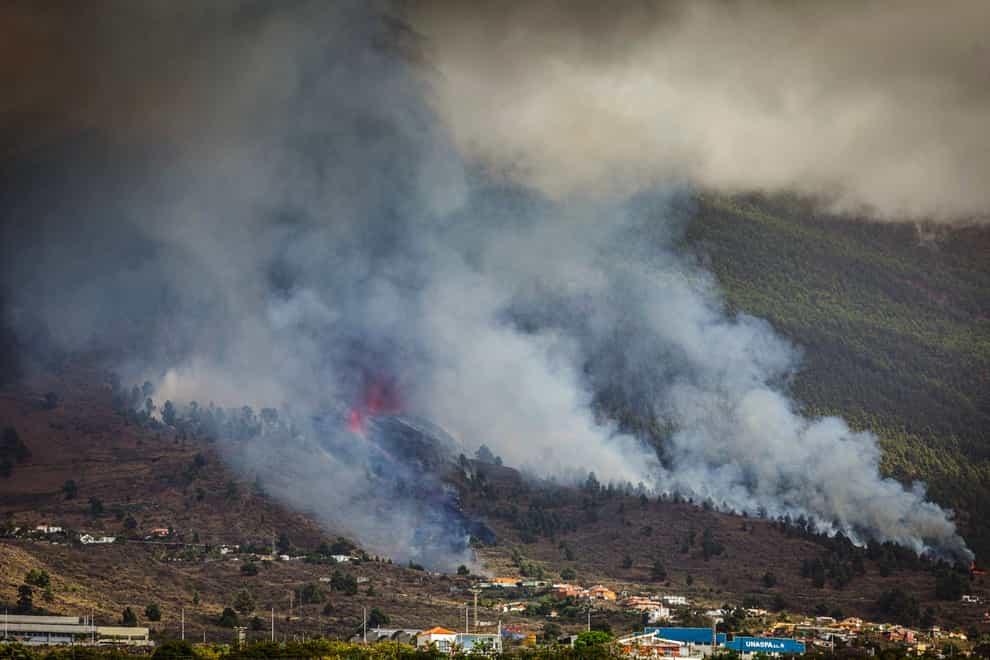Smoke rises at the Cumbre Viegja volcano (Jonathan Rodriguez/AP)