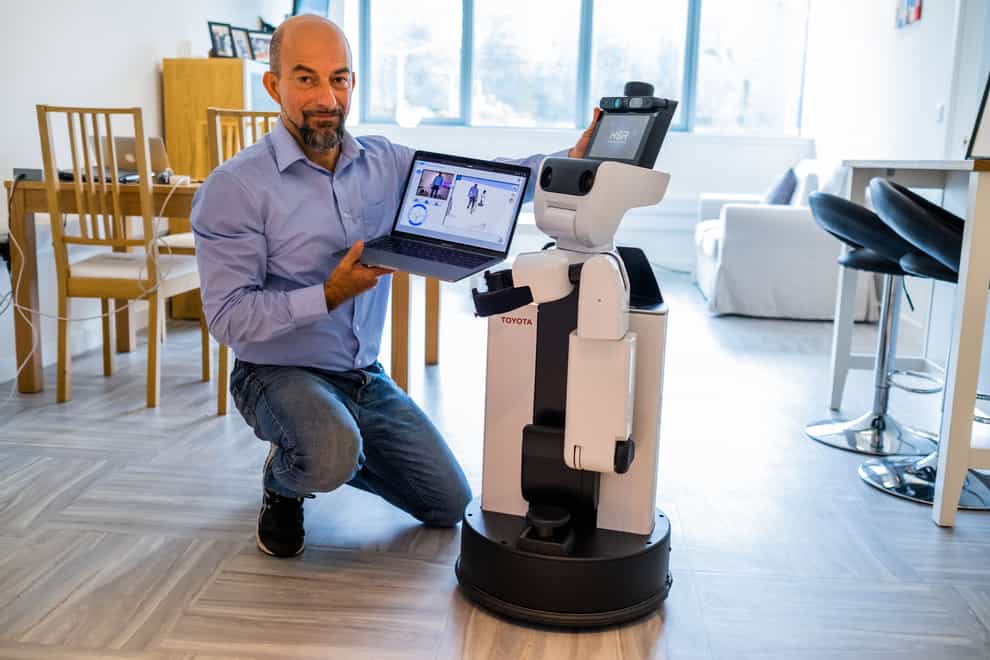 Dr Mauro Dragone with the assisted living robot (Heriot-Watt University/Chris Watt/PA)