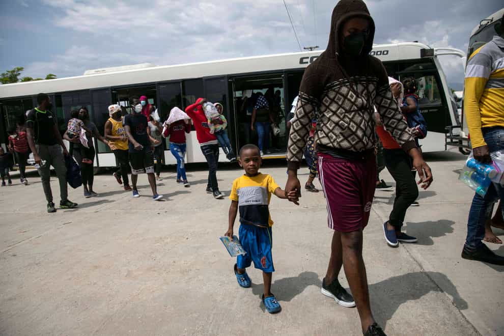 Haitians who were deported from the United States arrive at the Toussaint Louverture International Airport, in Port au Prince, Haiti, Sunday, Sep. 19, 2021. Thousands of Haitian migrants have been arriving to Del Rio, Texas, to ask for asylum in the U.S., as authorities begin to deported them to back to Haiti. (AP Photo/Rodrigo Abd)
