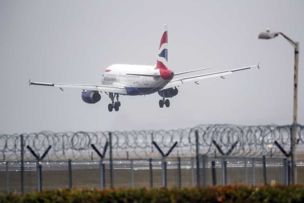 A British Airways plane lands in the strong winds at Heathrow airport,