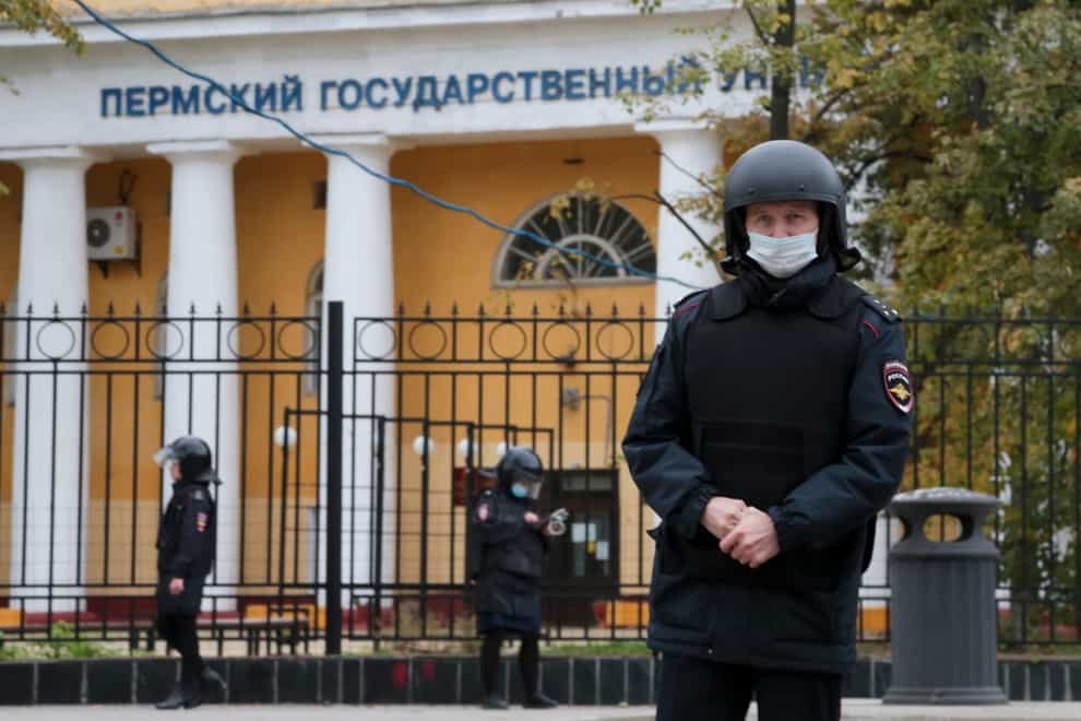 Police officers guard an area in front of the Perm State University in Perm, about 1,100 kilometers (700 miles) east of Moscow, Russia, Monday, Sept. 20, 2021. A gunman opened fire in a university in the Russian city of Perm on Monday morning, leaving at least eight people dead and others wounded, according to Russia’s Investigative Committee. (AP Photo)