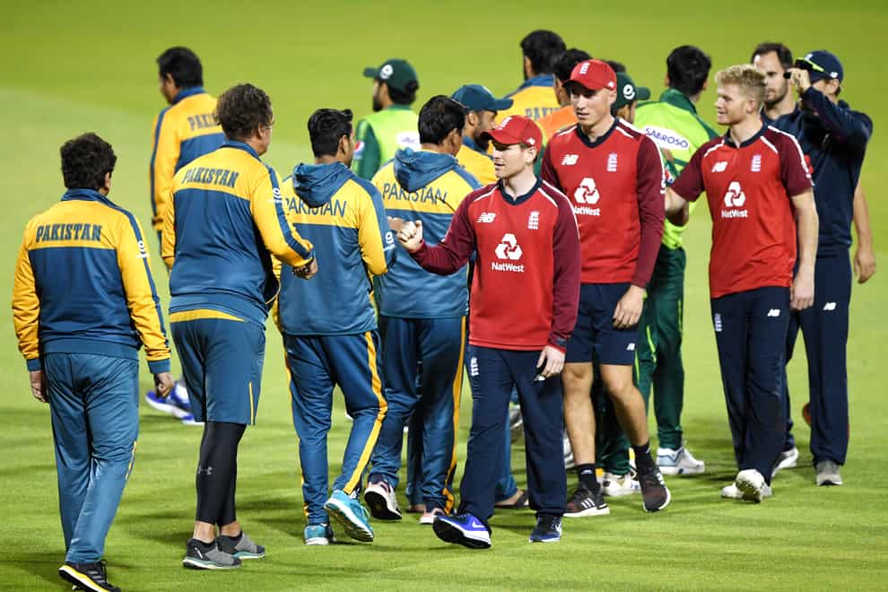 Pakistan and England players shake hands at the end of play during the third Vitality IT20 match at Old Trafford, Manchester.