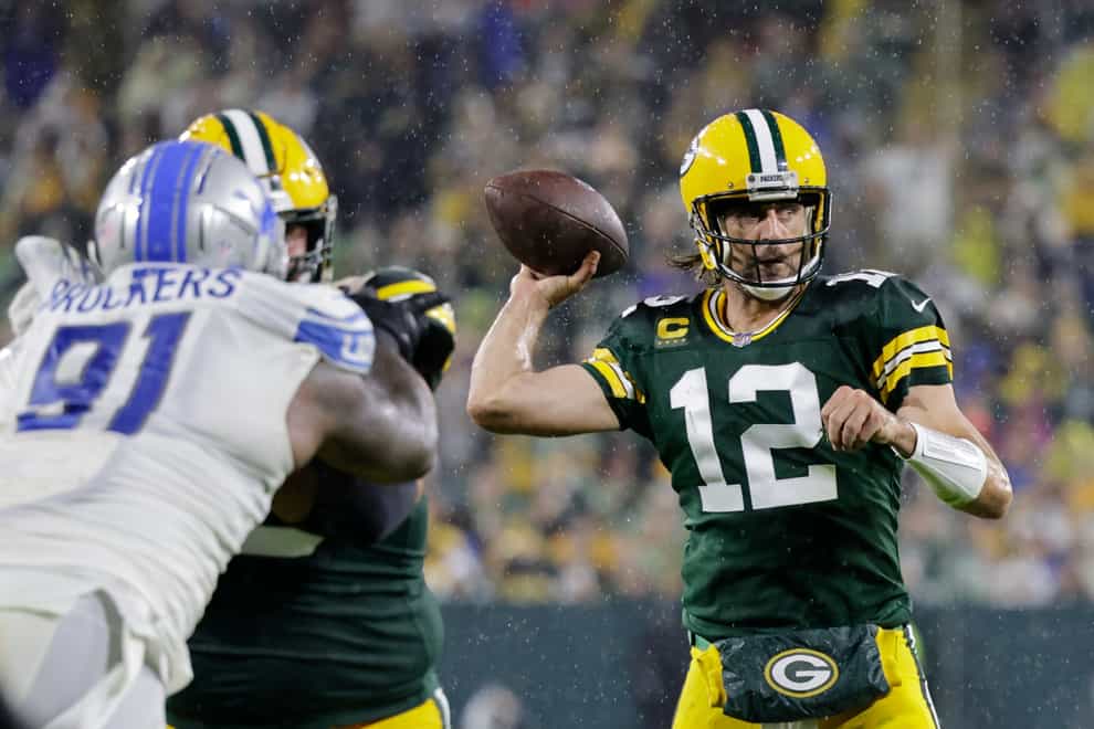 Aaron Rodgers bounced back from a torrid first game of the season to throw four touchdowns in a 35-17 win for the Green Bay Packers over the Detroit Lions (Mike Roemer/AP)