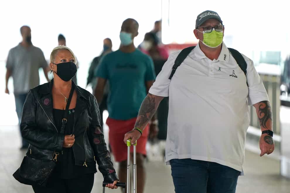 Charlotte Charles (left) and Tim Dunn, the parents of Harry Dunn arrive at Terminal 2 of Heathrow Airport, London, before departing on a flight to the US to give evidence under oath as part of a damages claim against their son???s alleged killer. Picture date: Tuesday June 29, 2021.