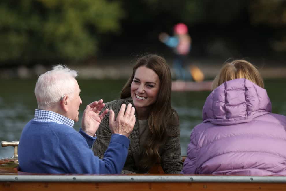 The Duchess of Cambridge (centre) meets Ike Alter and Diane Stoller in the steam launch Osprey (Scott Heppell/PA)