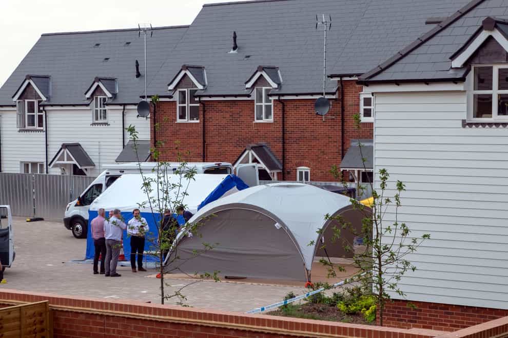 Police activity near a house at the centre of the Novichok attack (PA)