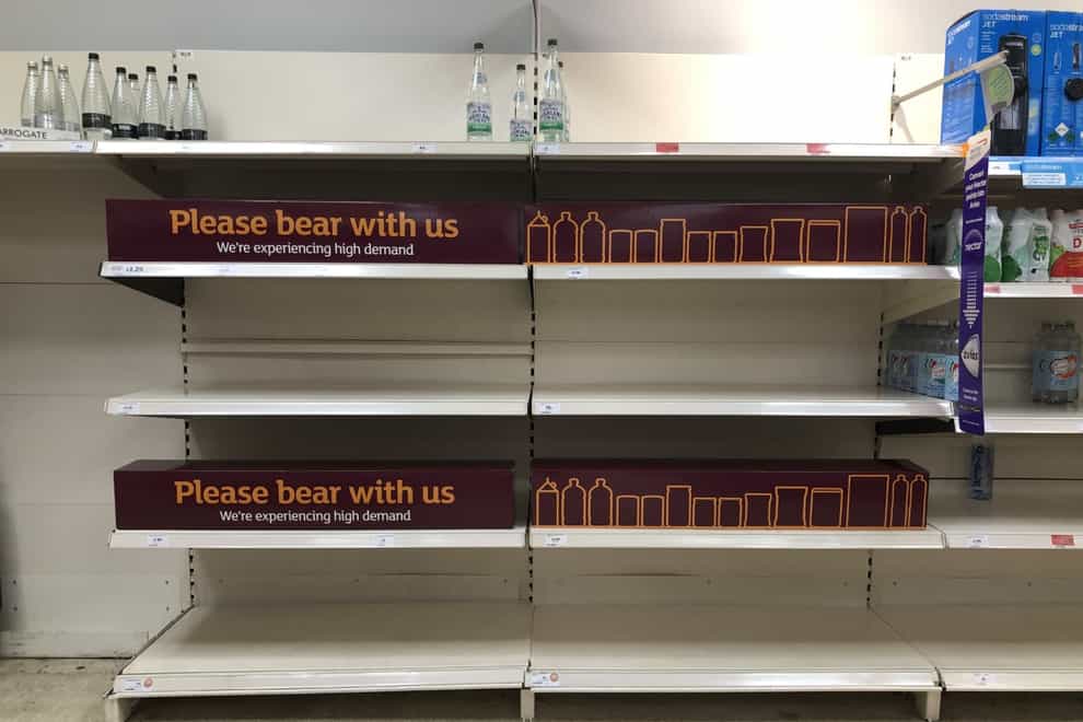 Empty shelves and signs on the soft drinks aisle of a Sainsbury’s store in Blackheath, Rowley Regis in the West Midlands.