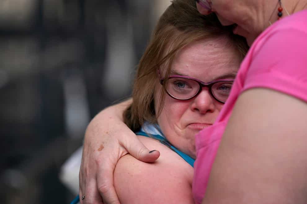 Heidi Crowter is comforted by her mother Liz outside the High Court in London (Gareth Fuller/PA)