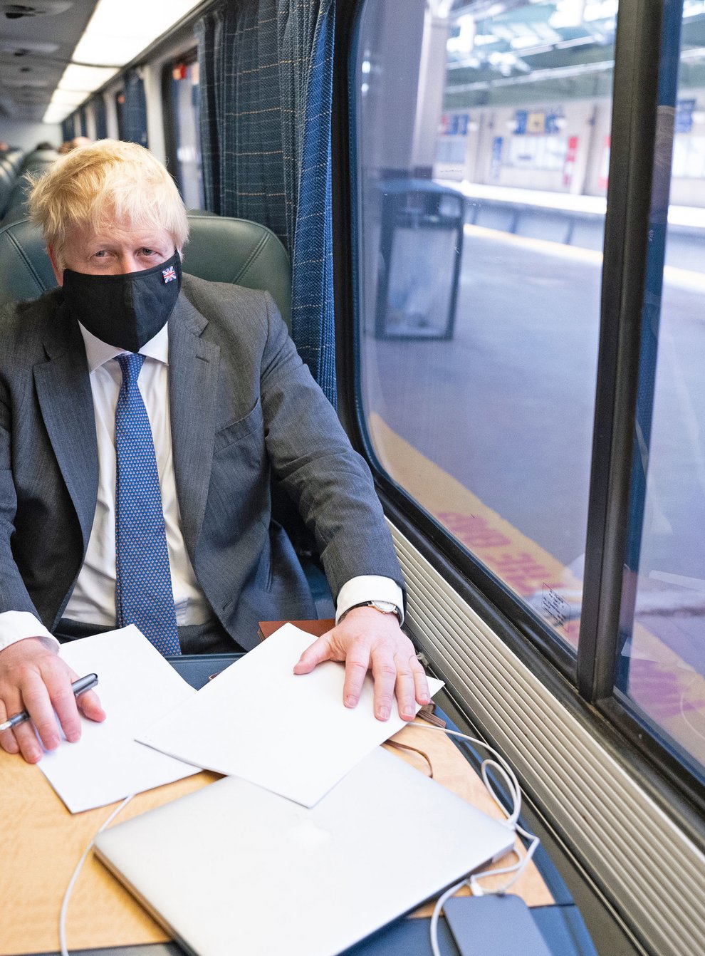 Prime Minister Boris Johnson spoke to reporters about Universal Credit while travelling on a train in the US (Stefan Rousseau/PA)