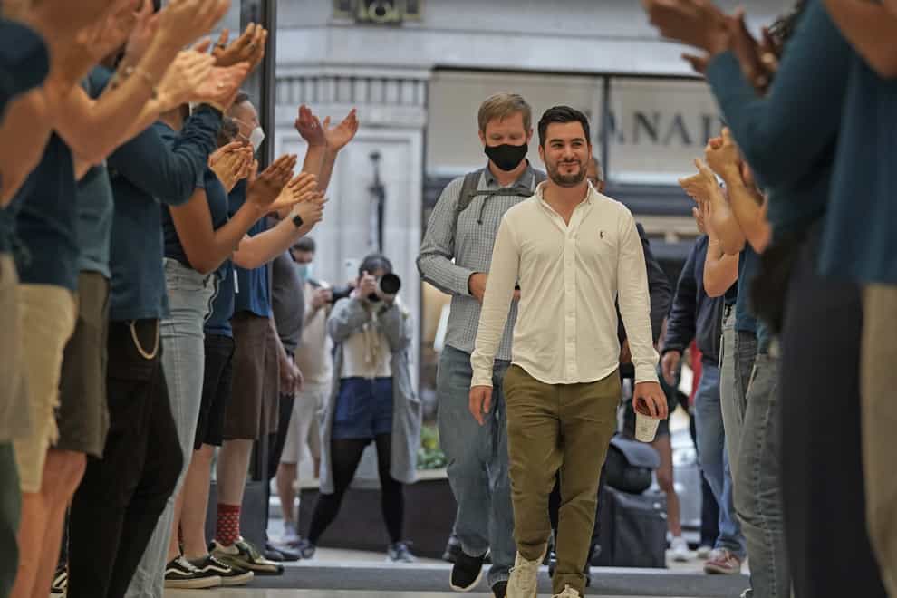 The first customers enter the Apple Store in Regent Street, central London, as the new Apple iPhone 13 goes on sale in the UK (Kirsty O’Connor/PA)