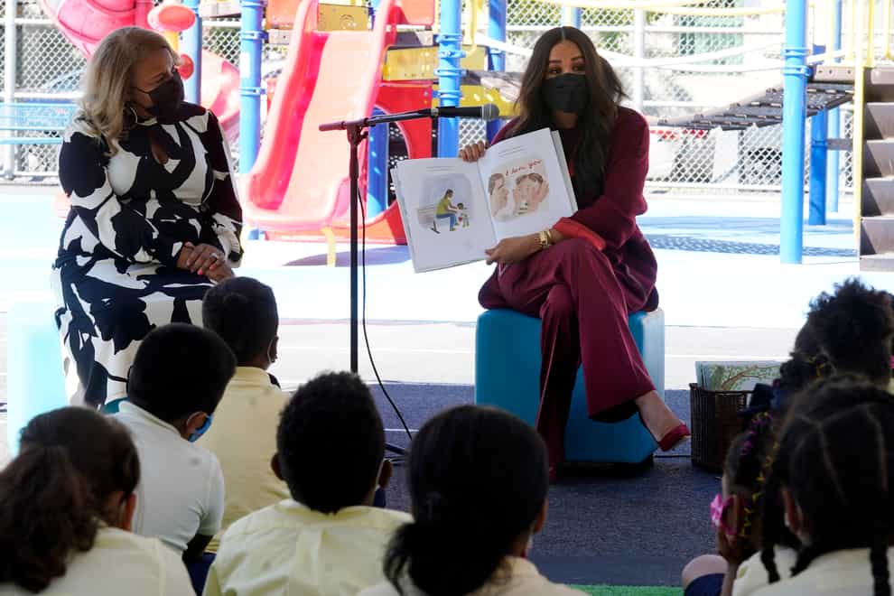 Meghan, the Duchess of Sussex, reads from her book The Bench during her visit with Prince Harry, to PS 123, the Mahalia Jackson School, in New York’s Harlem neighbourhood (Richard Drew/AP)