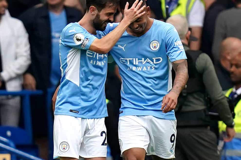 Manchester City’s Gabriel Jesus (right) celebrates his winner at Stamford Bridge with Bernardo Silva (Adam Davy/PA)