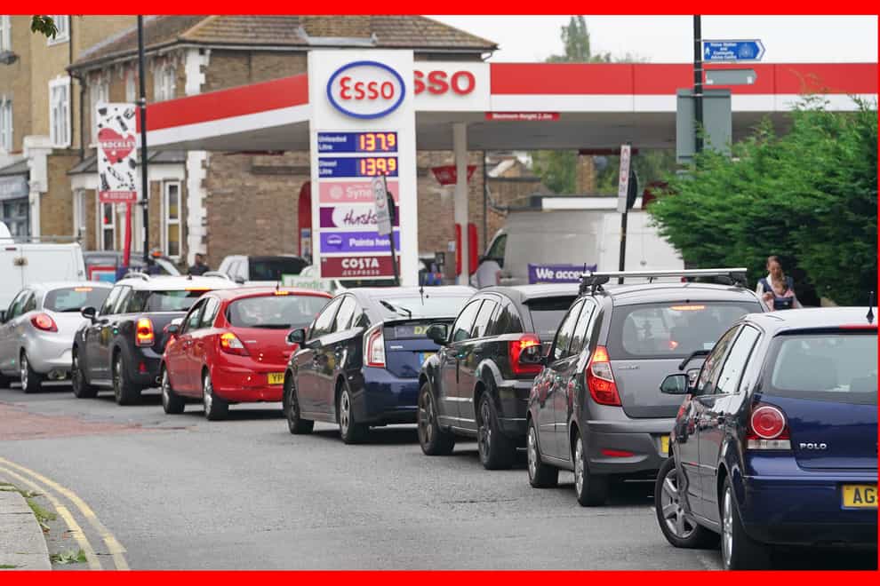 Motorists queue for petrol at an Esso petrol station in Brockley, south London (PA)