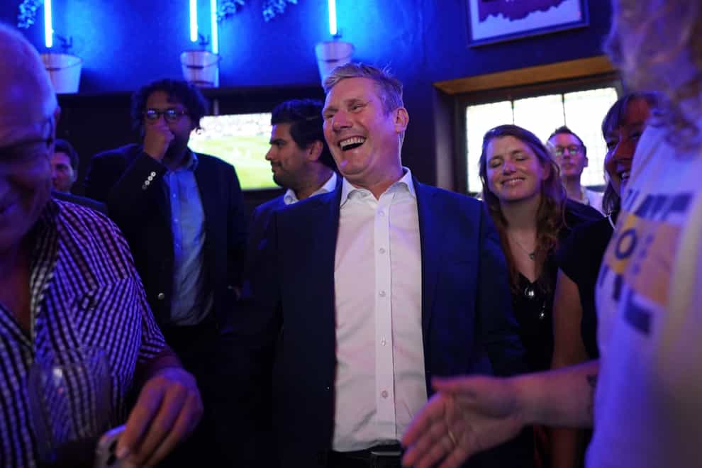 Labour Party leader Sir Keir Starmer speaks to members of the public as he watches the Arsenal v Tottenham Hotspur match at The Font pub in Brighton (PA)