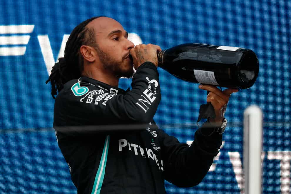 Lewis Hamilton toasts his 100th grand prix win (Yuri Kochetkov/AP)