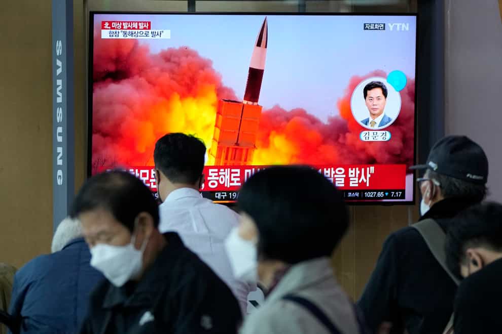 People watch a TV showing a file image of North Korea’s missile launch during a news program at the Seoul Railway Station on Tuesday (Ahn Young-joon/AP)
