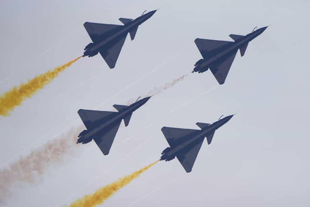 Members of the August 1 Aerobatic Team of the Chinese People’s Liberation Army Air Force perform during the 13th China International Aviation and Aerospace Exhibition (AP)