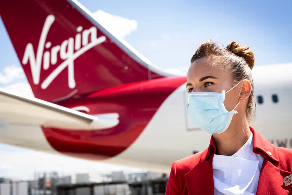 Virgin Atlantic has announced it will not hire new cabin crew or pilots who are not fully vaccinated against coronavirus (Matt Alexander/PA)