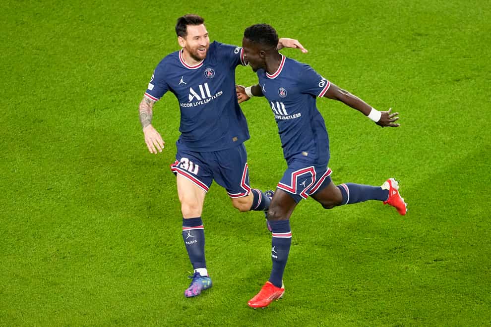 Paris St Germain goalscorers Lionel Messi, left, and Idrissa Gueye celebrate (Michel Euler/AP)