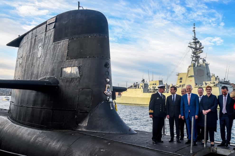Malcolm Turnbull signed a deal with France’s president Emmanuel Macron to buy a fleet of submarines (Brendan Esposito/via AP)